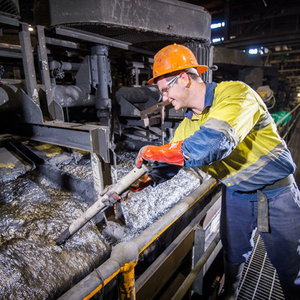 Mitchell Davidson, Processing Metallurgist, Zinc Processing at Glencore's Mount Isa Mines. Mitchell samples pulp during the lead floatation process at the Zinc Lead Concentrator. The photographer is Rob Parsons of Through The Looking Glass Studio. The Image Orientation is Landscape.